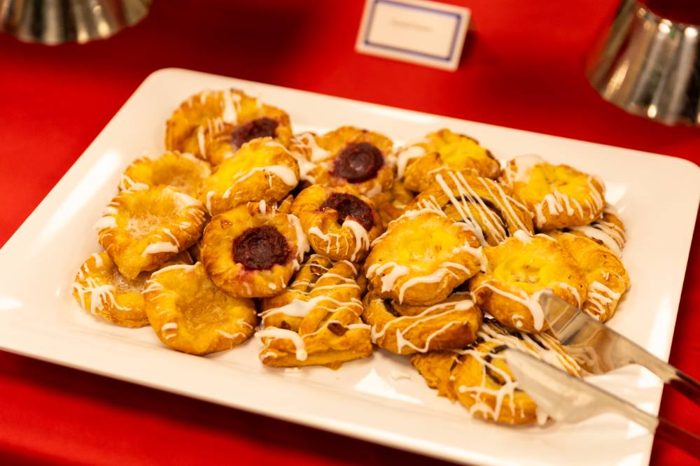 a table of various treats like croissants